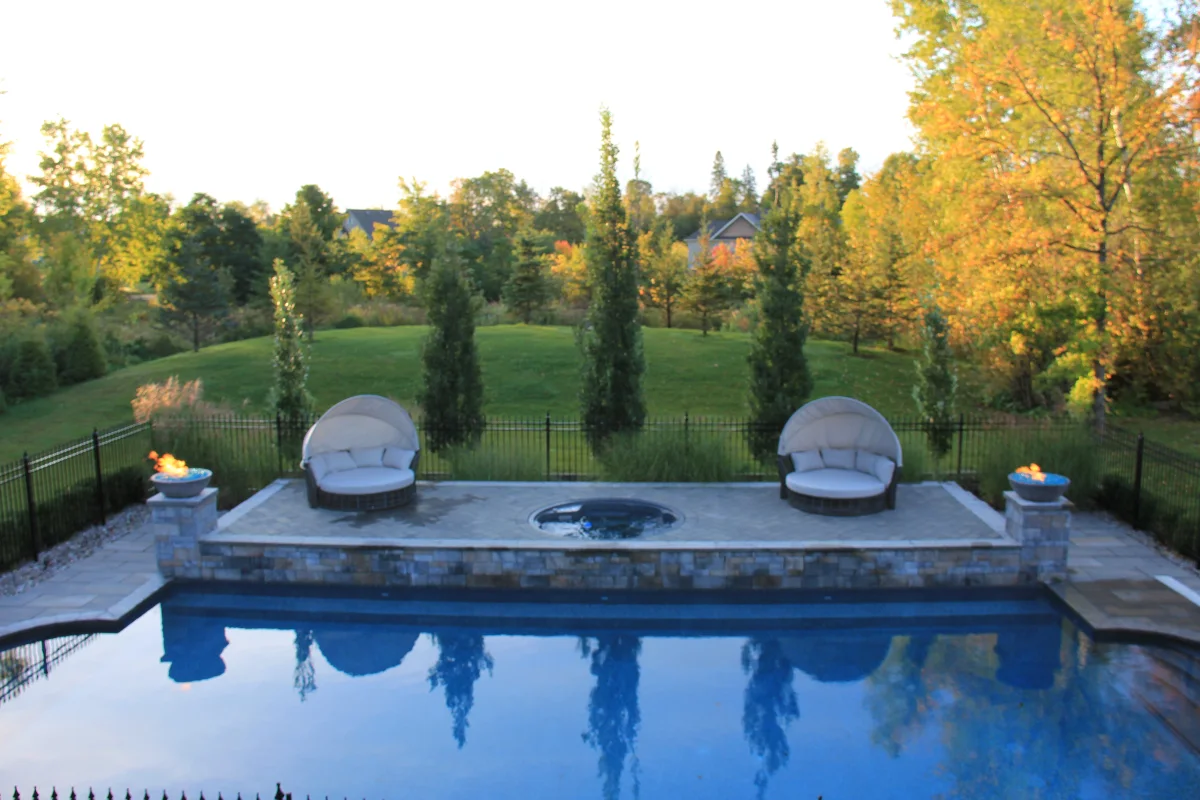 Estate pool viewed across the water toward fire bowls and cabana — Osmond Daly archive photograph IMG_7087