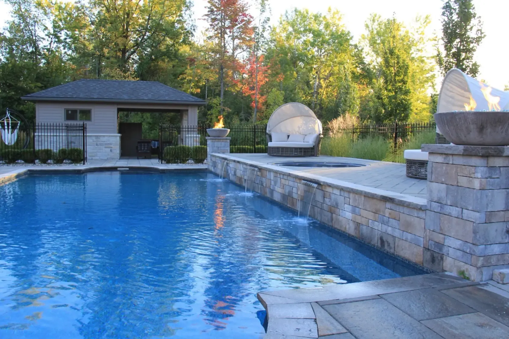 Osmond Daly Estate pool house, fire bowl and sheer waterfalls into the pool