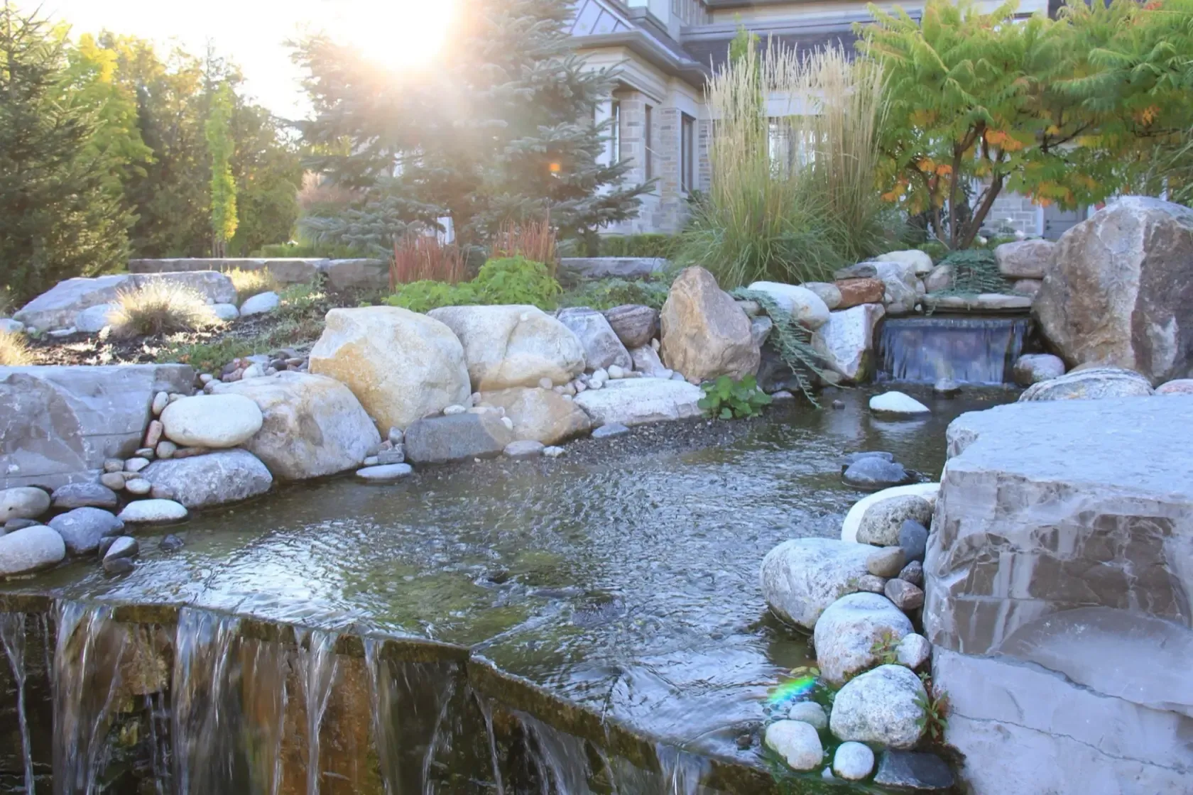 Water feature integrated into a finished landscape