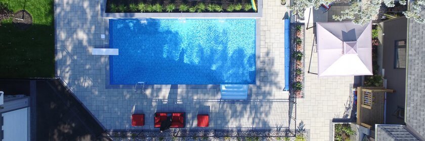 aerial view of backyard oasis with new inground pool and landscaping