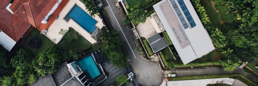 A bird's eye view of the variety of inground pools available in several backyards.