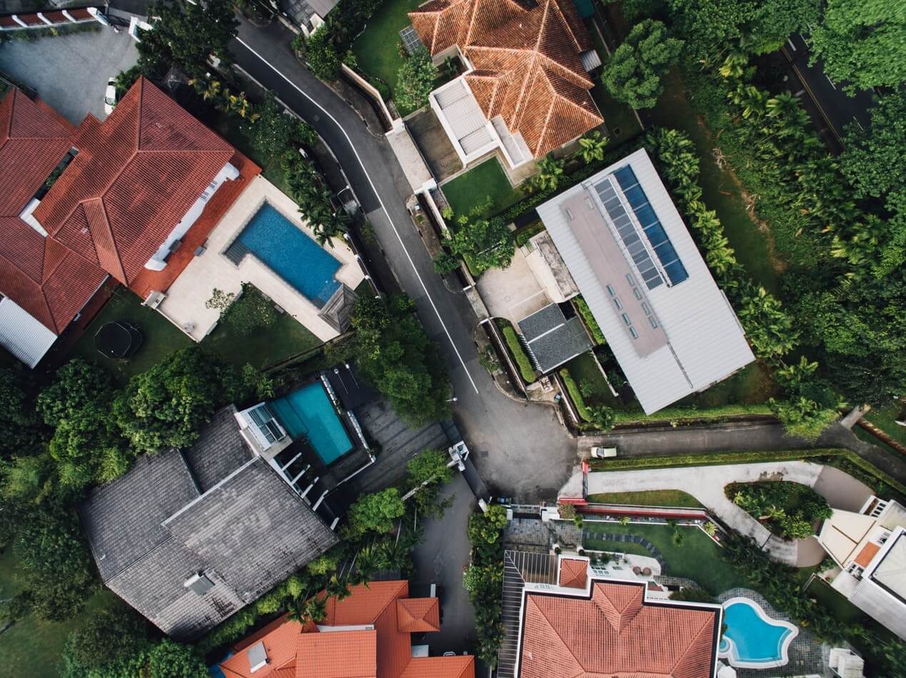 A bird's eye view of the variety of inground pools available in several backyards.