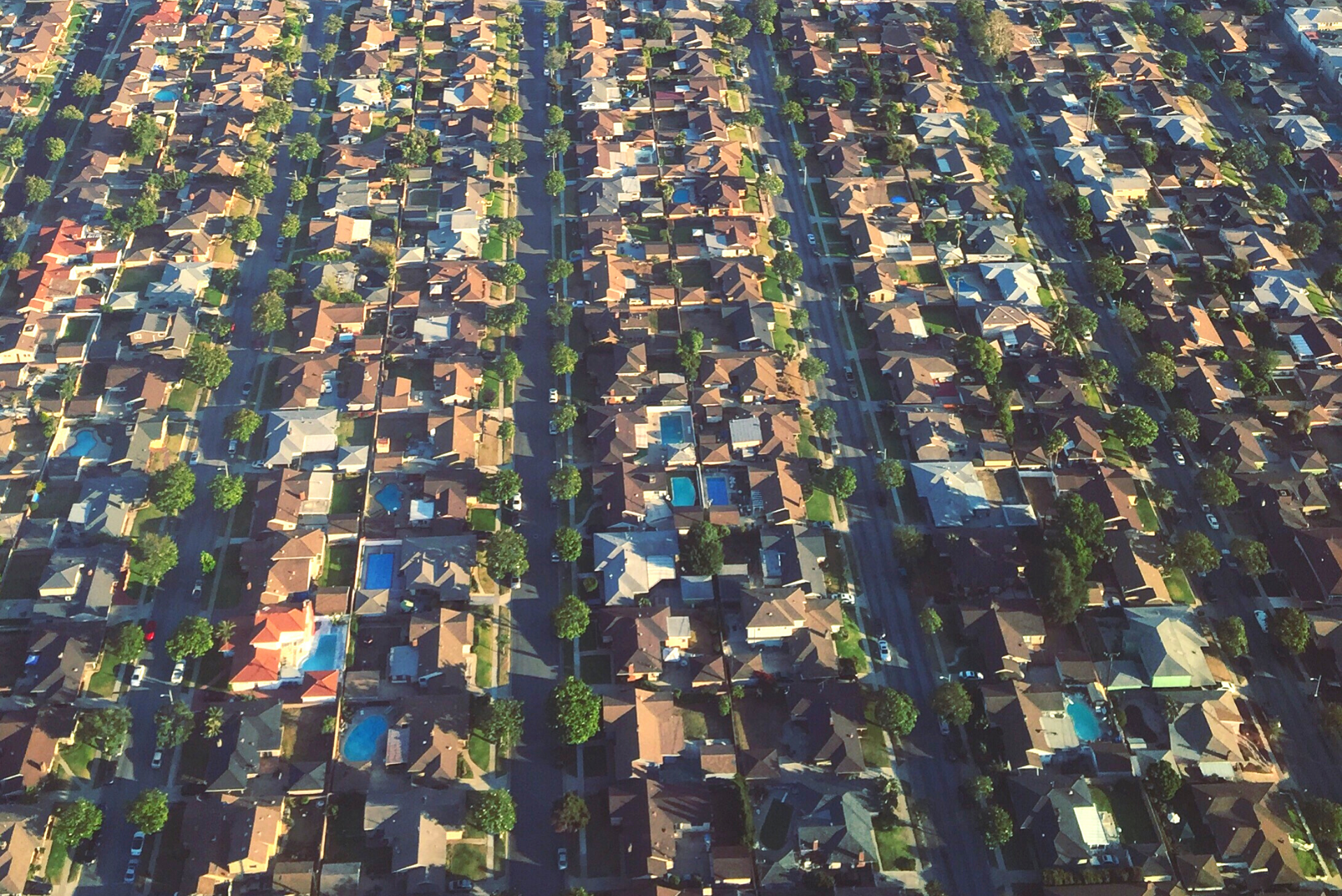 Aerial view of neighbourhood with lots of swimming pools