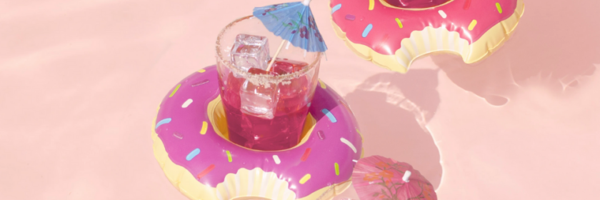 three mini donut drink floaters hold beverages in the pool