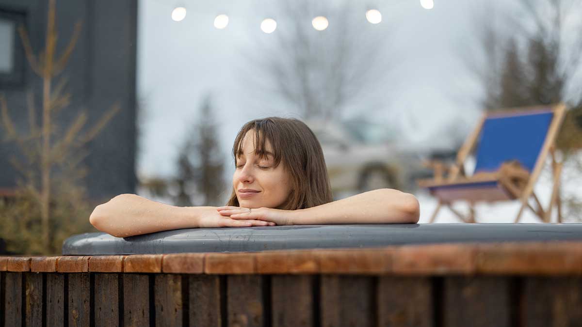 A woman relaxing in a hot tub