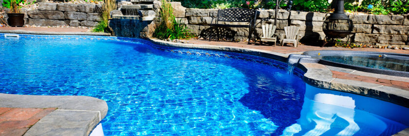 A picture of a backyard with a pool.