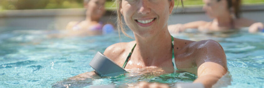 Women doing Aqua-fitness in her pool